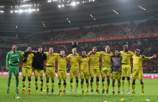 The team celebrates in front of the fancorner