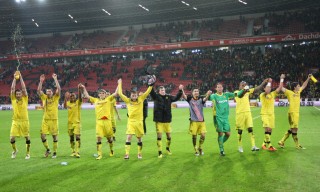 The team celebrates in front of the fancorner